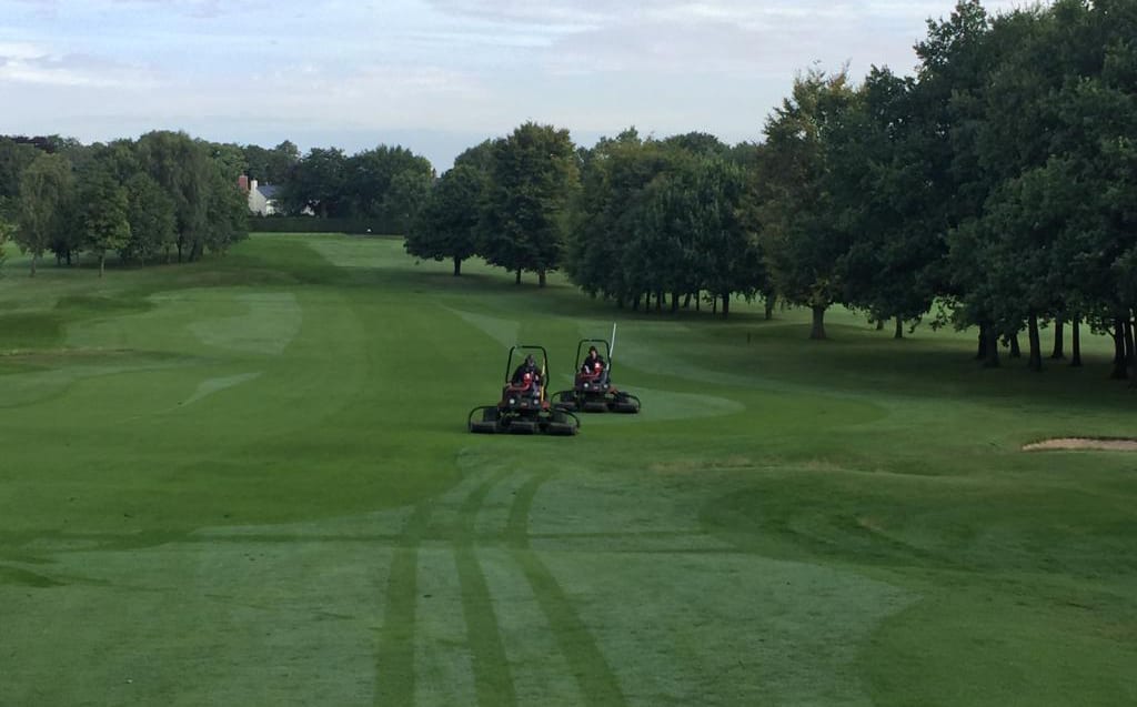 mowing a Golf course