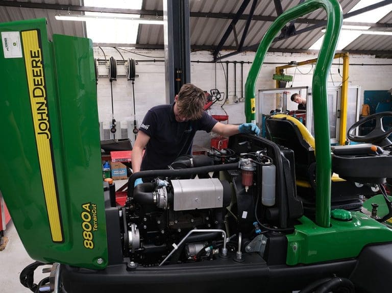 Man checking machine at the workshop