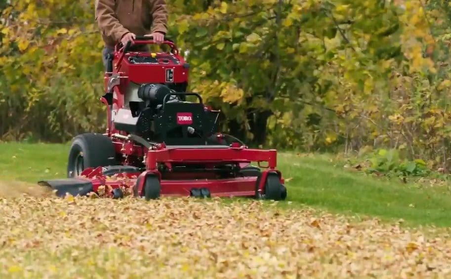 Groundcare Machinery In Staffordshire – Sales, Service &Amp; Repairs | Middlewich Machinery Toro stand on mower mowing a leaf filled grassy area